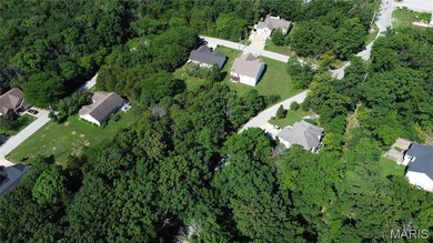 Discover an incredible opportunity with this buildable level lot on Raintree Country Club in Missouri - for sale on GolfHomes.com, golf home, golf lot