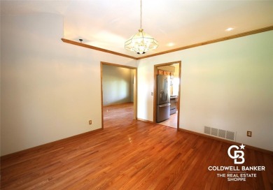 Enjoy peaceful evenings on your covered back deck overlooking on The Golf Club At Southwind in Kansas - for sale on GolfHomes.com, golf home, golf lot