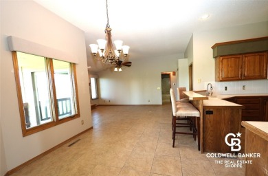 Enjoy peaceful evenings on your covered back deck overlooking on The Golf Club At Southwind in Kansas - for sale on GolfHomes.com, golf home, golf lot