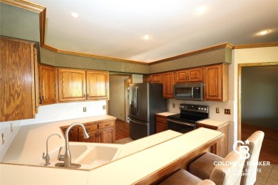 Enjoy peaceful evenings on your covered back deck overlooking on The Golf Club At Southwind in Kansas - for sale on GolfHomes.com, golf home, golf lot