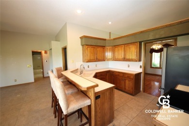 Enjoy peaceful evenings on your covered back deck overlooking on The Golf Club At Southwind in Kansas - for sale on GolfHomes.com, golf home, golf lot