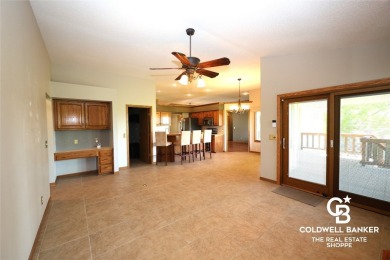 Enjoy peaceful evenings on your covered back deck overlooking on The Golf Club At Southwind in Kansas - for sale on GolfHomes.com, golf home, golf lot