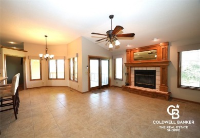 Enjoy peaceful evenings on your covered back deck overlooking on The Golf Club At Southwind in Kansas - for sale on GolfHomes.com, golf home, golf lot
