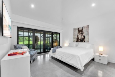 Bright and inviting, this 3-bedroom, 3-bath bungalow offers on Palm Beach Polo and Country Club in Florida - for sale on GolfHomes.com, golf home, golf lot