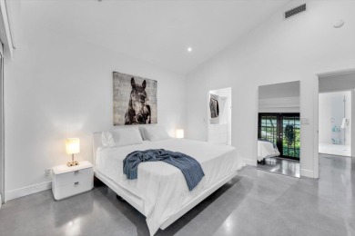Bright and inviting, this 3-bedroom, 3-bath bungalow offers on Palm Beach Polo and Country Club in Florida - for sale on GolfHomes.com, golf home, golf lot