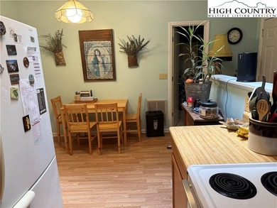 Welcome to 61 River Loop, a charming mountain retreat nestled on Land Harbor Golf Course in North Carolina - for sale on GolfHomes.com, golf home, golf lot