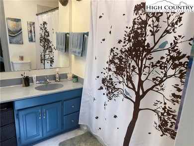 Welcome to 61 River Loop, a charming mountain retreat nestled on Land Harbor Golf Course in North Carolina - for sale on GolfHomes.com, golf home, golf lot