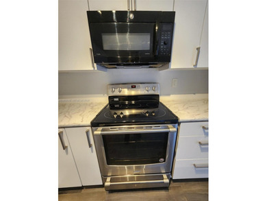 Wake up every morning to a serene golf course and water views in on Pine Island Ridge Country Club in Florida - for sale on GolfHomes.com, golf home, golf lot