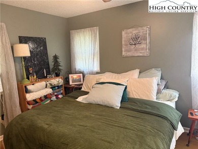 Welcome to 61 River Loop, a charming mountain retreat nestled on Land Harbor Golf Course in North Carolina - for sale on GolfHomes.com, golf home, golf lot