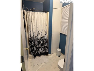 Welcome to 61 River Loop, a charming mountain retreat nestled on Land Harbor Golf Course in North Carolina - for sale on GolfHomes.com, golf home, golf lot