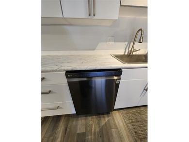 Wake up every morning to a serene golf course and water views in on Pine Island Ridge Country Club in Florida - for sale on GolfHomes.com, golf home, golf lot