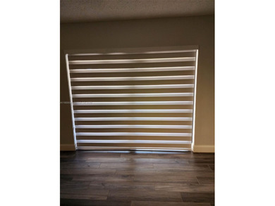 Wake up every morning to a serene golf course and water views in on Pine Island Ridge Country Club in Florida - for sale on GolfHomes.com, golf home, golf lot