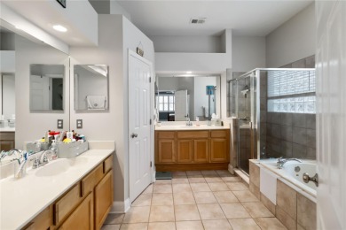 This stunning 3-bedroom, 2.5-bathroom pool home offers the on Hunters Creek Golf Course in Florida - for sale on GolfHomes.com, golf home, golf lot