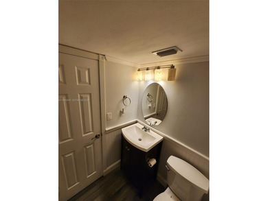 Wake up every morning to a serene golf course and water views in on Pine Island Ridge Country Club in Florida - for sale on GolfHomes.com, golf home, golf lot