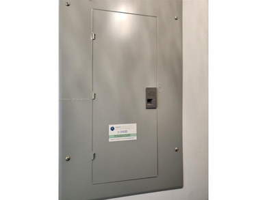 Wake up every morning to a serene golf course and water views in on Pine Island Ridge Country Club in Florida - for sale on GolfHomes.com, golf home, golf lot