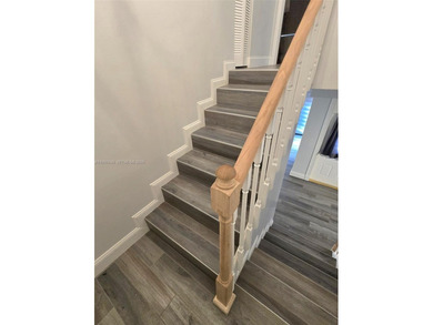 Wake up every morning to a serene golf course and water views in on Pine Island Ridge Country Club in Florida - for sale on GolfHomes.com, golf home, golf lot