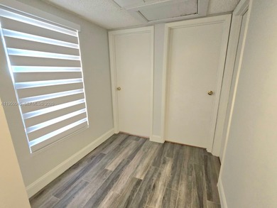 Wake up every morning to a serene golf course and water views in on Pine Island Ridge Country Club in Florida - for sale on GolfHomes.com, golf home, golf lot