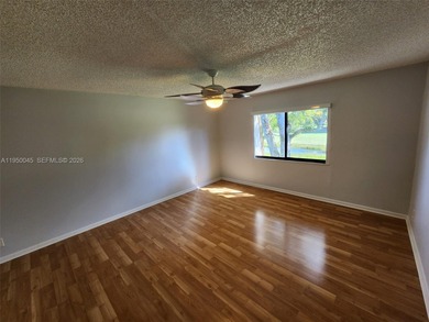 Wake up every morning to a serene golf course and water views in on Pine Island Ridge Country Club in Florida - for sale on GolfHomes.com, golf home, golf lot