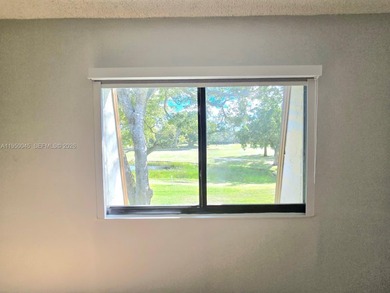 Wake up every morning to a serene golf course and water views in on Pine Island Ridge Country Club in Florida - for sale on GolfHomes.com, golf home, golf lot