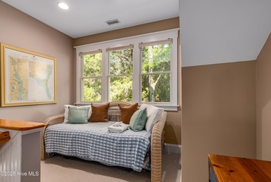 Nestled in the tranquil maritime forest of Bald Head Island on Bald Head Island Golf Club in North Carolina - for sale on GolfHomes.com, golf home, golf lot