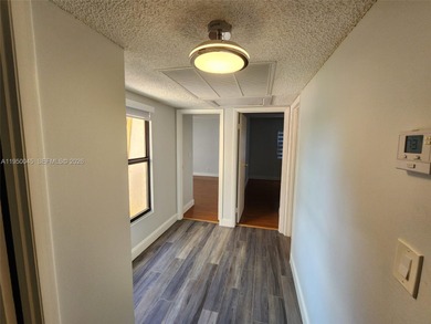 Wake up every morning to a serene golf course and water views in on Pine Island Ridge Country Club in Florida - for sale on GolfHomes.com, golf home, golf lot