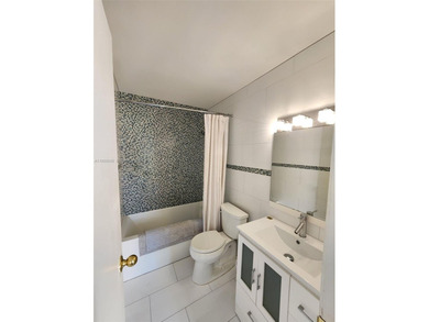 Wake up every morning to a serene golf course and water views in on Pine Island Ridge Country Club in Florida - for sale on GolfHomes.com, golf home, golf lot