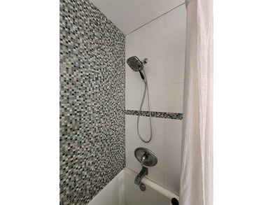 Wake up every morning to a serene golf course and water views in on Pine Island Ridge Country Club in Florida - for sale on GolfHomes.com, golf home, golf lot