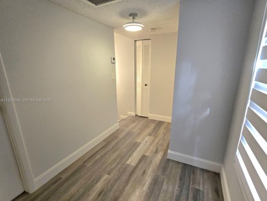 Wake up every morning to a serene golf course and water views in on Pine Island Ridge Country Club in Florida - for sale on GolfHomes.com, golf home, golf lot