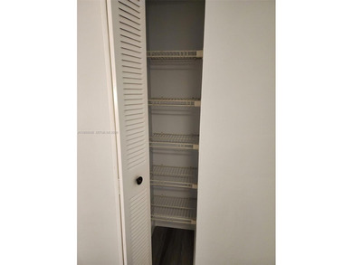 Wake up every morning to a serene golf course and water views in on Pine Island Ridge Country Club in Florida - for sale on GolfHomes.com, golf home, golf lot