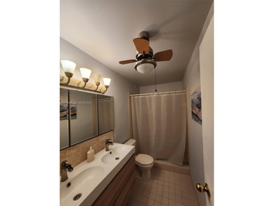 Wake up every morning to a serene golf course and water views in on Pine Island Ridge Country Club in Florida - for sale on GolfHomes.com, golf home, golf lot