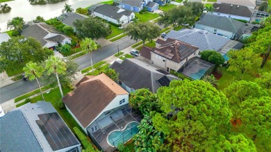 This stunning 3-bedroom, 2.5-bathroom pool home offers the on Hunters Creek Golf Course in Florida - for sale on GolfHomes.com, golf home, golf lot