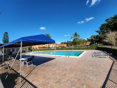 Wake up every morning to a serene golf course and water views in on Pine Island Ridge Country Club in Florida - for sale on GolfHomes.com, golf home, golf lot