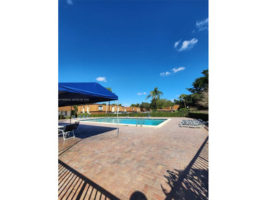 Wake up every morning to a serene golf course and water views in on Pine Island Ridge Country Club in Florida - for sale on GolfHomes.com, golf home, golf lot