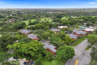 Wake up every morning to a serene golf course and water views in on Pine Island Ridge Country Club in Florida - for sale on GolfHomes.com, golf home, golf lot