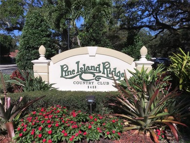 Wake up every morning to a serene golf course and water views in on Pine Island Ridge Country Club in Florida - for sale on GolfHomes.com, golf home, golf lot