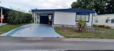 Come settle down and relax in a beautiful, manufactured home on Fairways Country Club in Florida - for sale on GolfHomes.com, golf home, golf lot