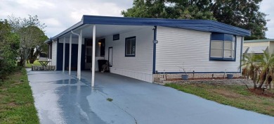 Come settle down and relax in a beautiful, manufactured home on Fairways Country Club in Florida - for sale on GolfHomes.com, golf home, golf lot
