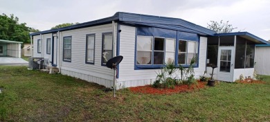 Come settle down and relax in a beautiful, manufactured home on Fairways Country Club in Florida - for sale on GolfHomes.com, golf home, golf lot