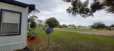 Come settle down and relax in a beautiful, manufactured home on Fairways Country Club in Florida - for sale on GolfHomes.com, golf home, golf lot