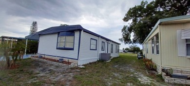 Come settle down and relax in a beautiful, manufactured home on Fairways Country Club in Florida - for sale on GolfHomes.com, golf home, golf lot