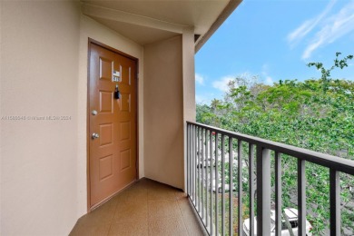 This top-floor corner unit boasts a well-maintained interior on Flamingo Lakes Country Club in Florida - for sale on GolfHomes.com, golf home, golf lot