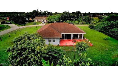 Charming Single-Family Home in Lehigh Acres - Spacious, Modern & on River Hall Country Club in Florida - for sale on GolfHomes.com, golf home, golf lot