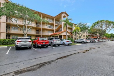 This top-floor corner unit boasts a well-maintained interior on Flamingo Lakes Country Club in Florida - for sale on GolfHomes.com, golf home, golf lot