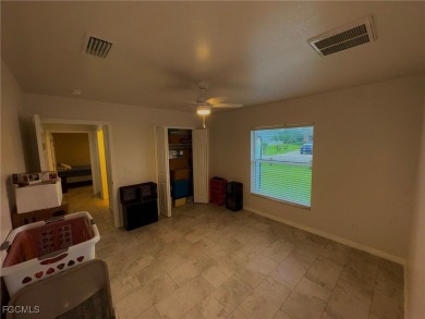 Charming Single-Family Home in Lehigh Acres - Spacious, Modern & on River Hall Country Club in Florida - for sale on GolfHomes.com, golf home, golf lot