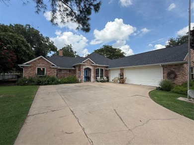 Located in the highly sought-after gated community of Pecan on Pecan Plantation Country Club in Texas - for sale on GolfHomes.com, golf home, golf lot