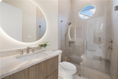 This fully renovated custom residence presents a rare on West Bay Beach and Golf Club in Florida - for sale on GolfHomes.com, golf home, golf lot