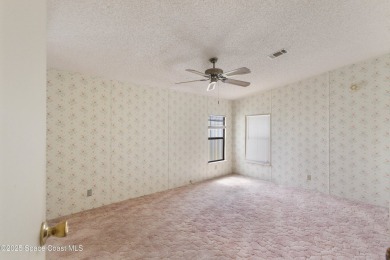Welcome home to this mmaculate move-in-ready 2 bedroom 2 bath on Barefoot Bay Golf Course in Florida - for sale on GolfHomes.com, golf home, golf lot