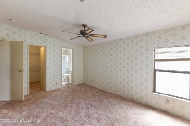 Welcome home to this mmaculate move-in-ready 2 bedroom 2 bath on Barefoot Bay Golf Course in Florida - for sale on GolfHomes.com, golf home, golf lot