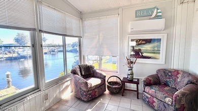 WATERFRONT HOME WITH BOAT DOCK/LIFT. Welcome to your dream home on Riverbend Golf and Country Club in Florida - for sale on GolfHomes.com, golf home, golf lot