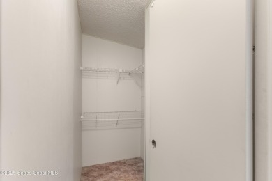 Welcome home to this mmaculate move-in-ready 2 bedroom 2 bath on Barefoot Bay Golf Course in Florida - for sale on GolfHomes.com, golf home, golf lot